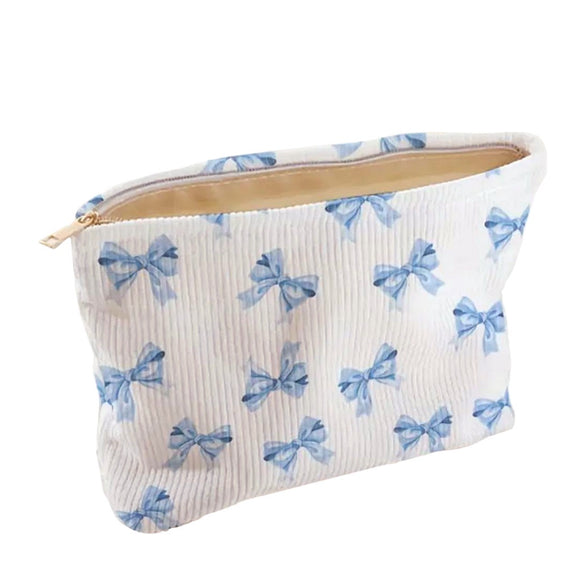 COSMETIC BAG TEXTURED WHITE WITH BLUE BOWS