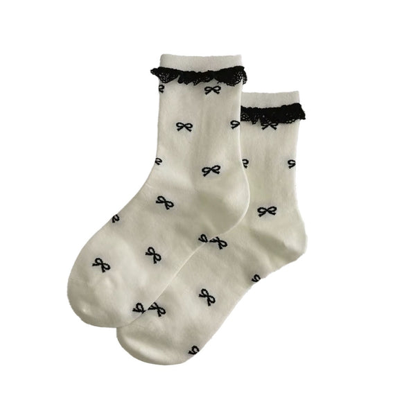 SOCKS WITH LACE AND BLACK BOWS ON IVORY